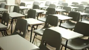 A classroom with school chairs and tables