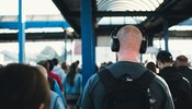 Man on train wearing headphones
