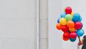 Woman holding balloons