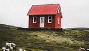 Isolated red house on a hill
