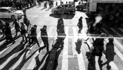 people crossing road in busy street