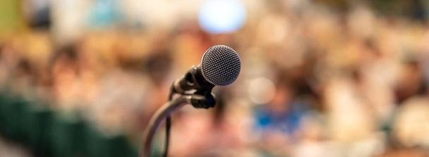 stock-photo-microphone-abstract-blurred-photo-conference